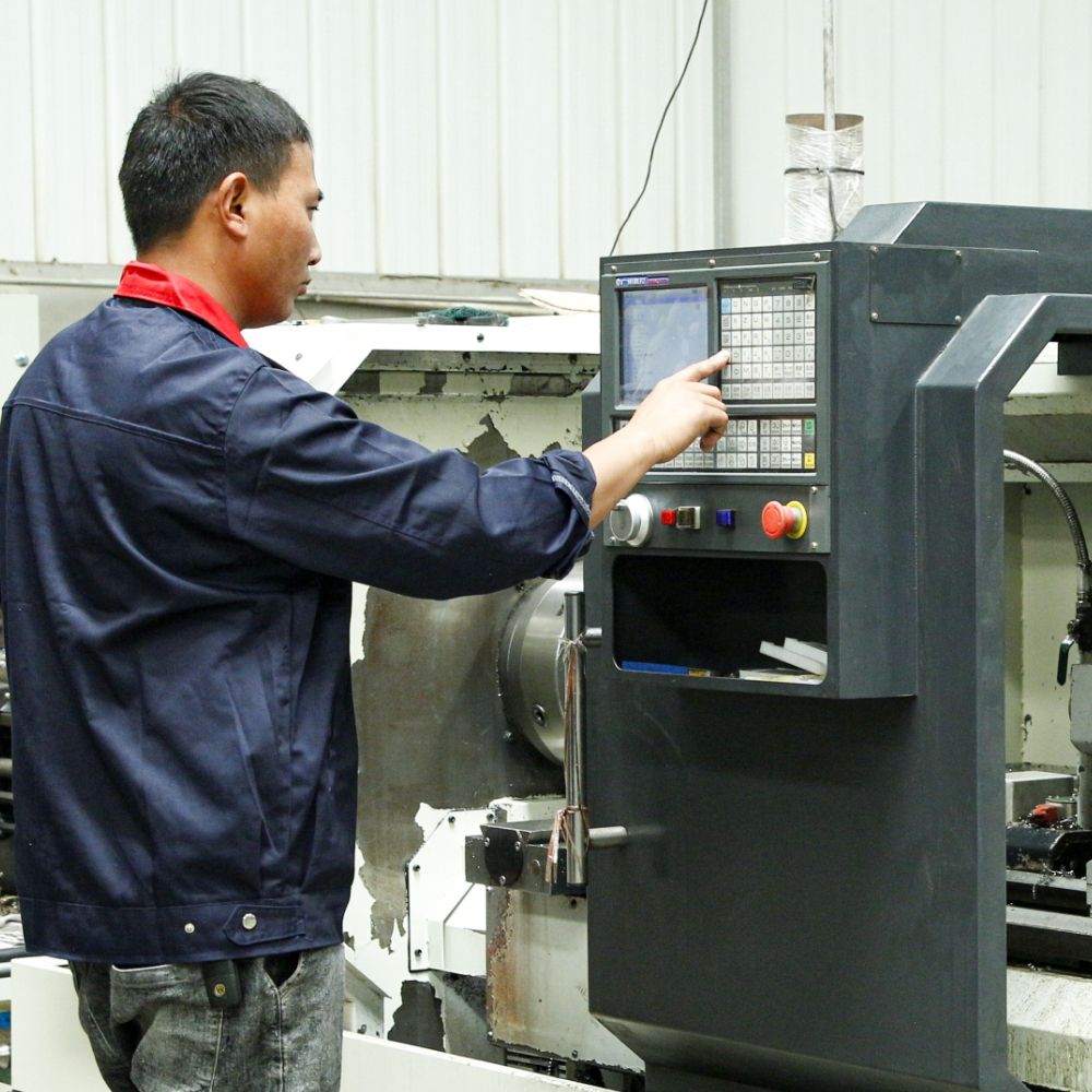 The operator is debugging the CNC machine tool.