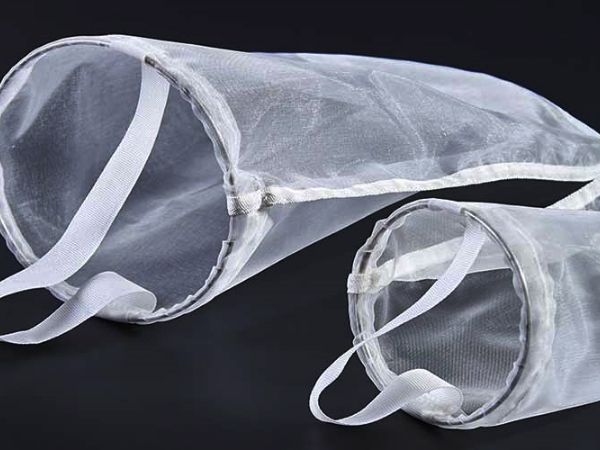 Sewn metal ring sealed filter bag